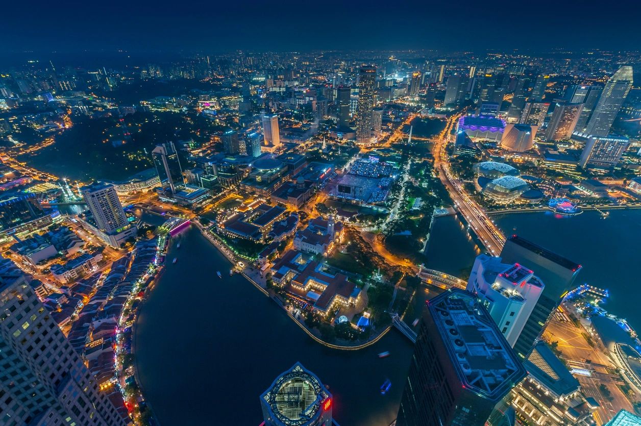 A city at night with lights and buildings